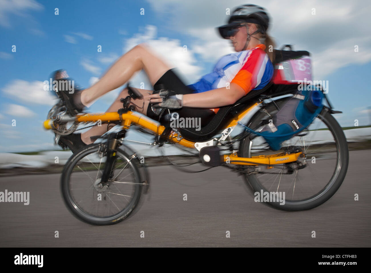 The Netherlands, Biddinghuizen, Races of recumbent bicycles. Woman. Stock Photo
