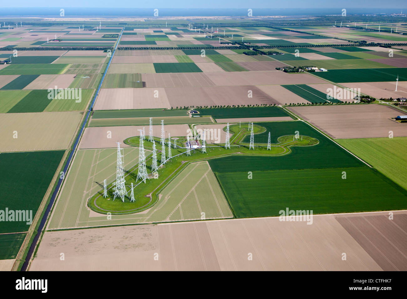 The Netherlands, Zeewolde, Farms and farmland in Flevopolder. Aerial. Broadcasting TV towers. Stock Photo