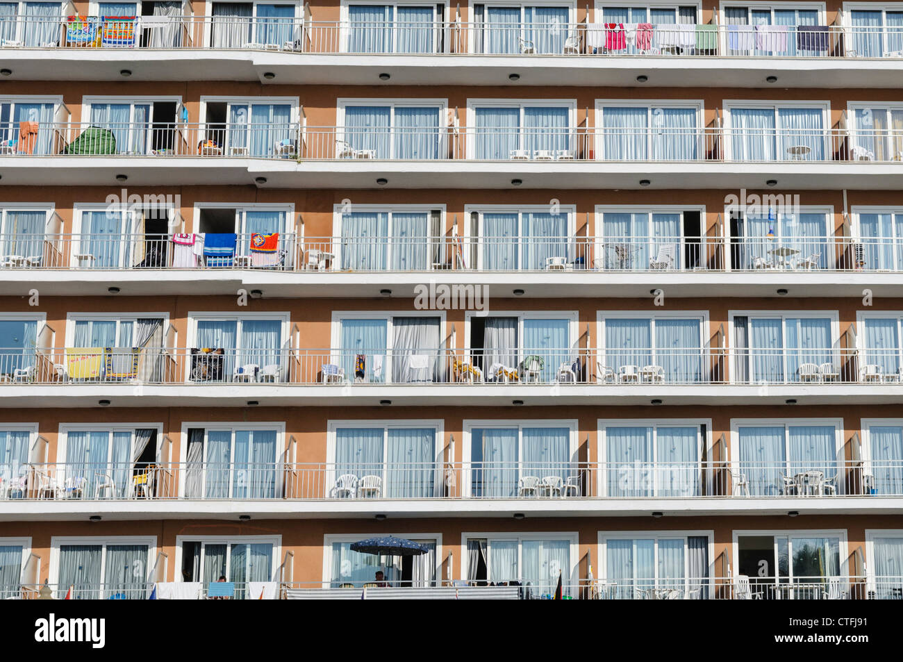 Typical balconies of a Spanish hotel during the tourist season Stock Photo
