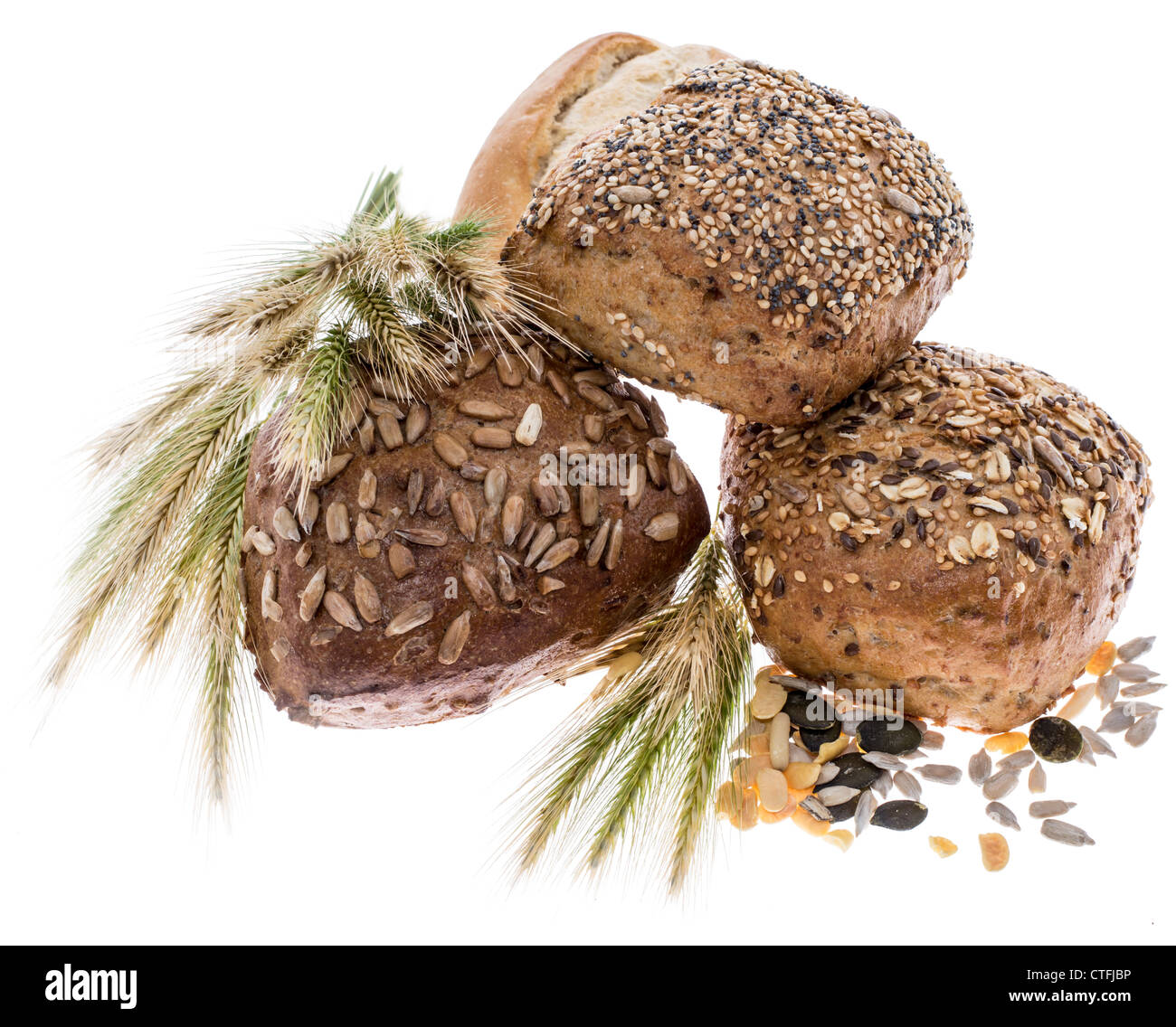 Three rolls with wheat isolated on white background Stock Photo
