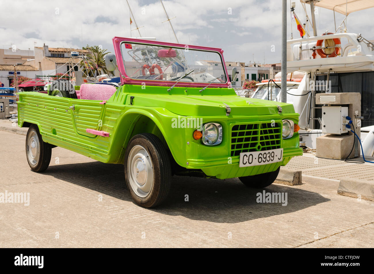 Citroën Méhari off-road jeep in fluorescent green and pink. Body is made from ABS plastic. Chassis from 2CV. Stock Photo