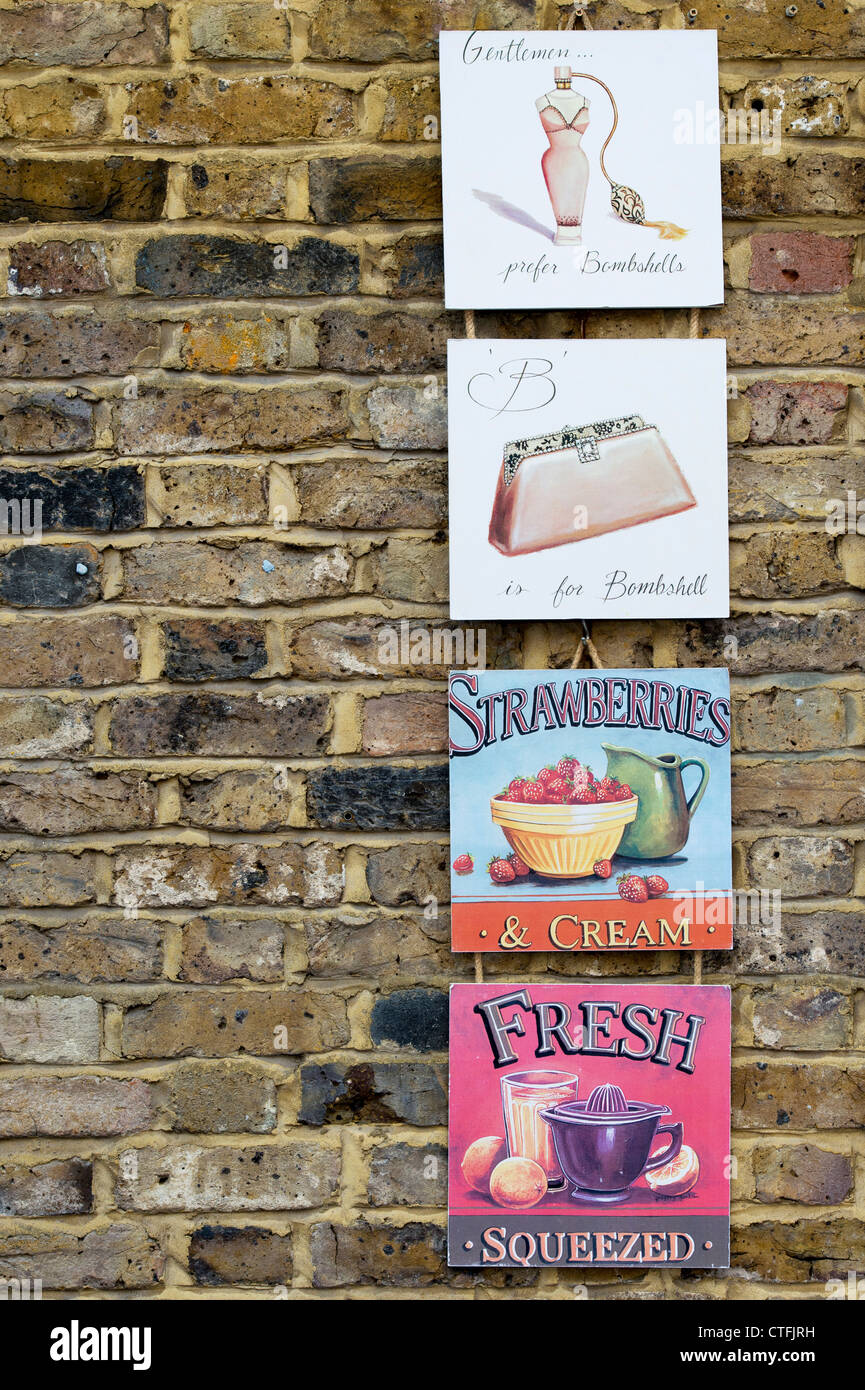 Hanging wall plaques. Portobello Market. London Stock Photo