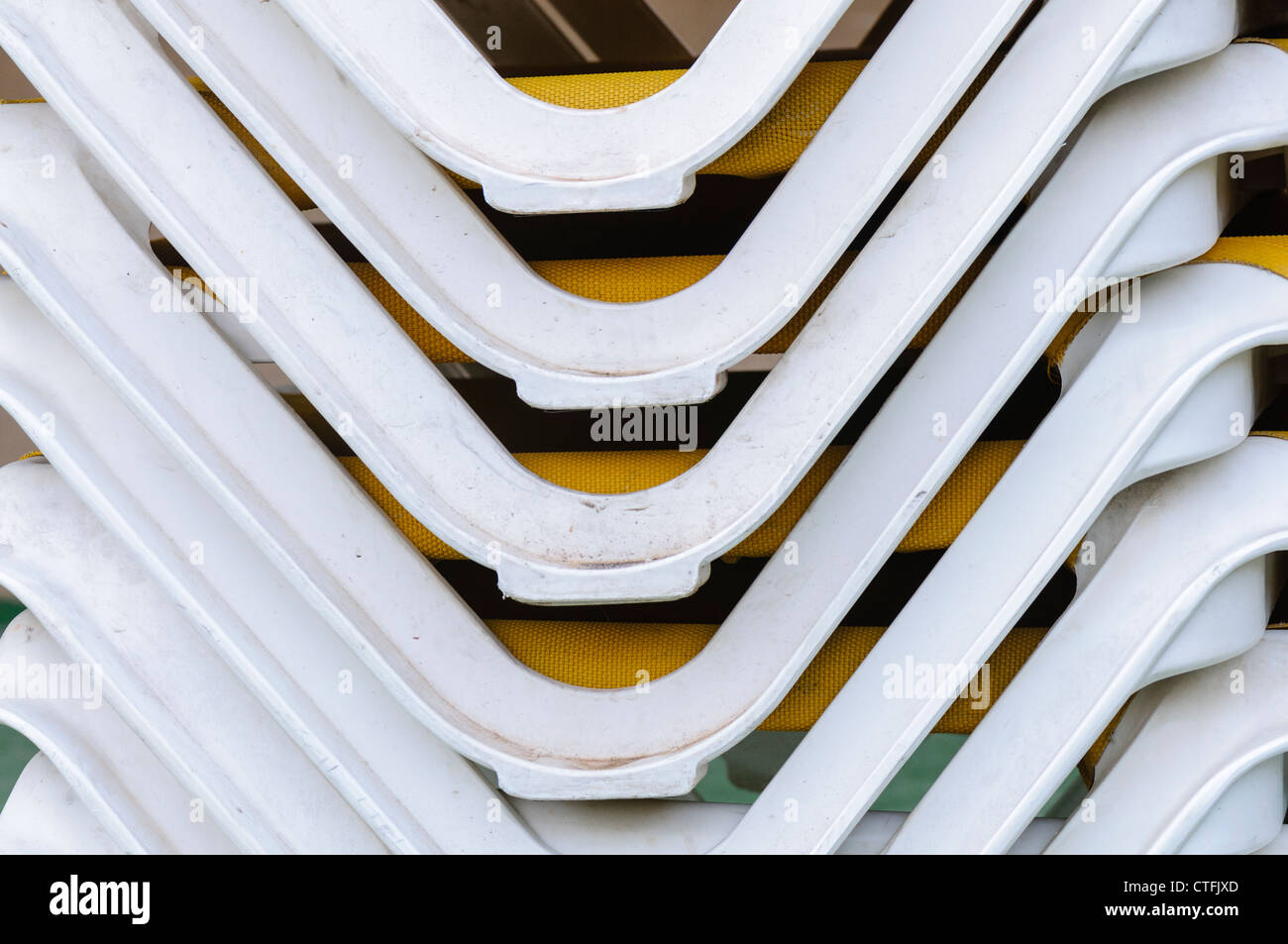 Sunloungers stacked up in a hotel Stock Photo