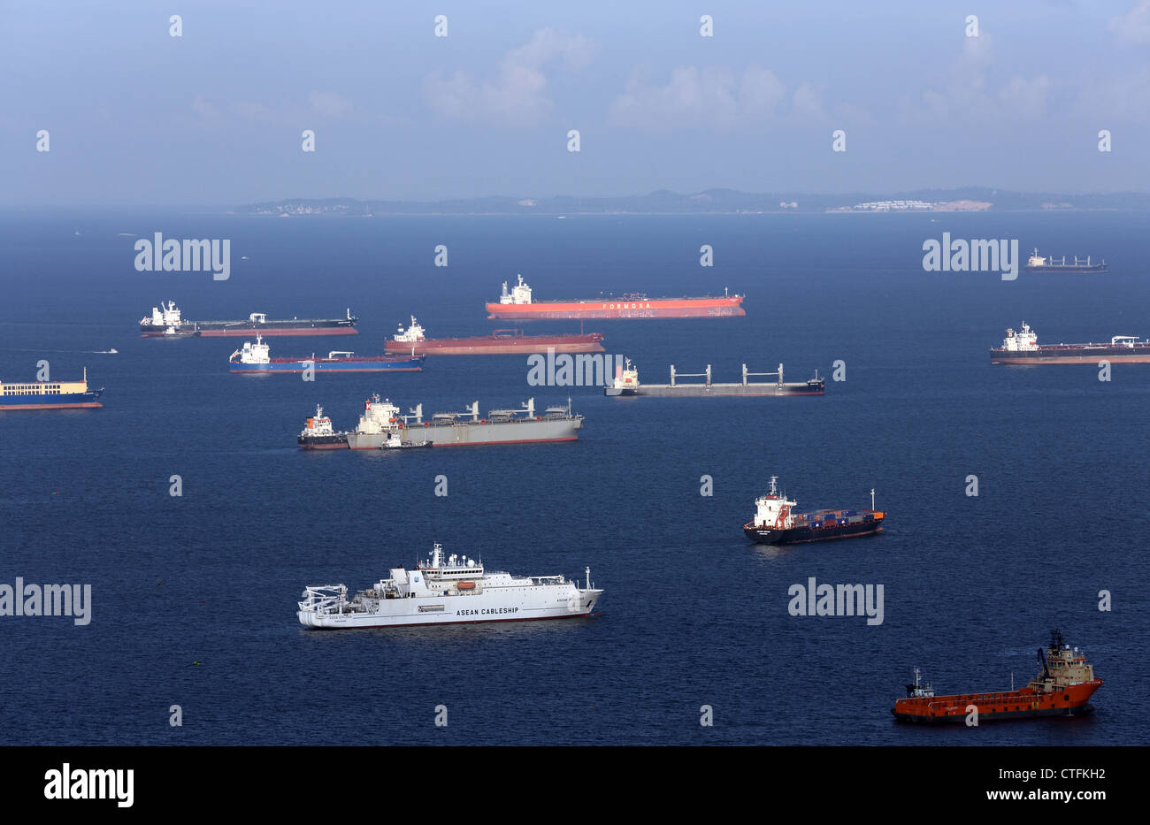 Ships anchored in Singapore Strait waiting for loading and unloading of cargo. Stock Photo