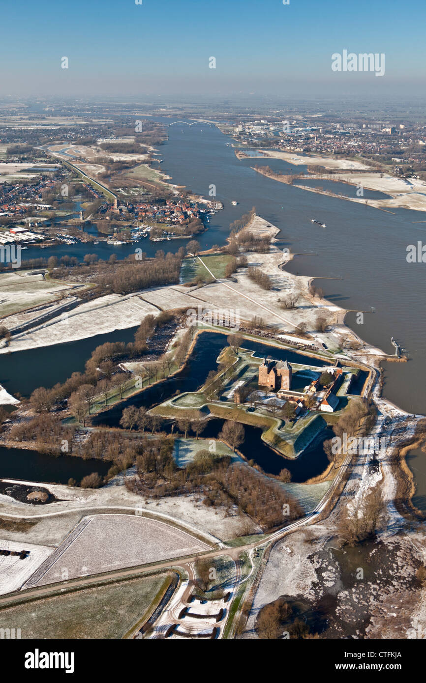 The Netherlands, Zaltbommel, Castle called Loevestein, background city of Woudrichem Aerial, winter, frost. Stock Photo
