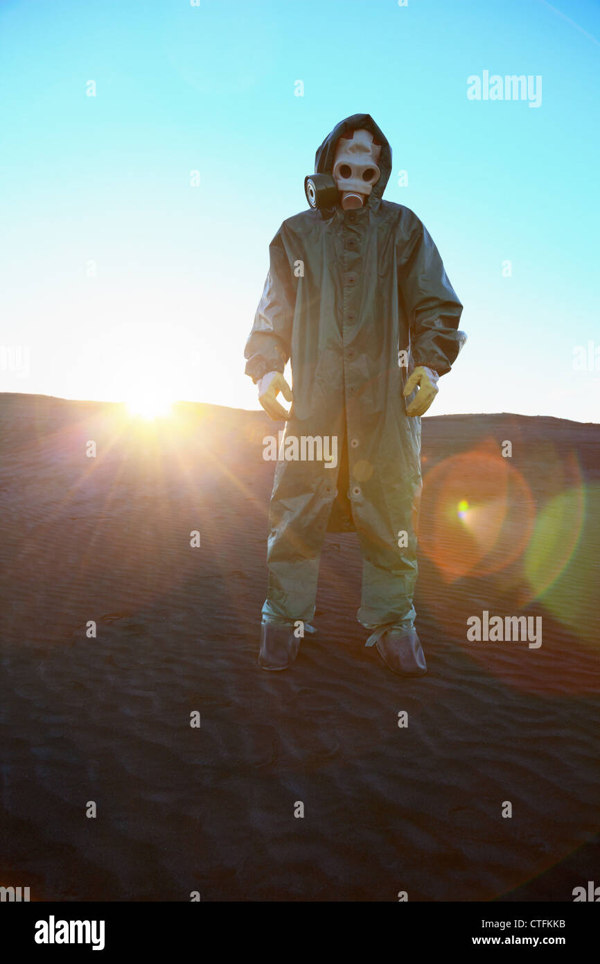 A man in protective suit and bright rays of the sun Stock Photo