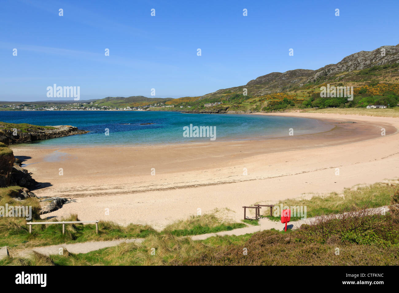 Stunning view down to quiet Big Sands beach on northwest Highlands coast under blue skies. Gairloch Wester Ross Ross and Cromarty Highland Scotland UK Stock Photo