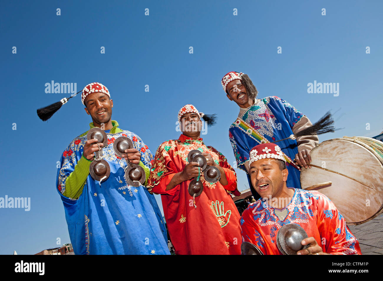 Morocco, Marrakech Square called Djemaa El Fna. Group of Gnawa Musicians. Stock Photo