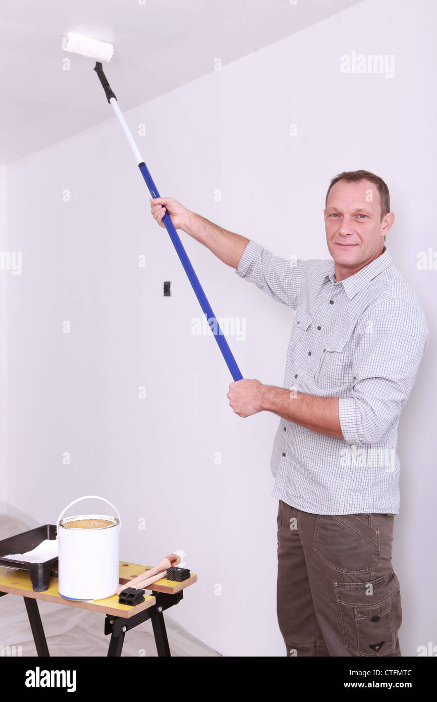 Man Painting Ceiling With Roller Stock Photo 49518124 Alamy