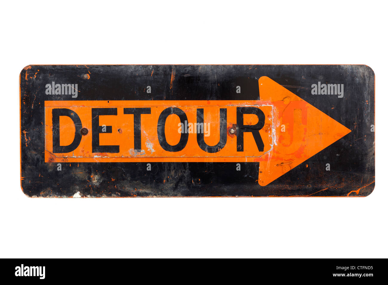 A very old, orange and black detour sign on a white background Stock Photo