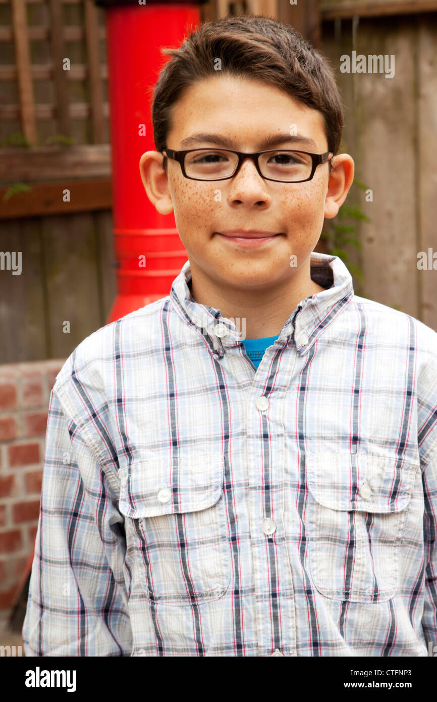 A young boy in glasses looking at the camera Stock Photo - Alamy