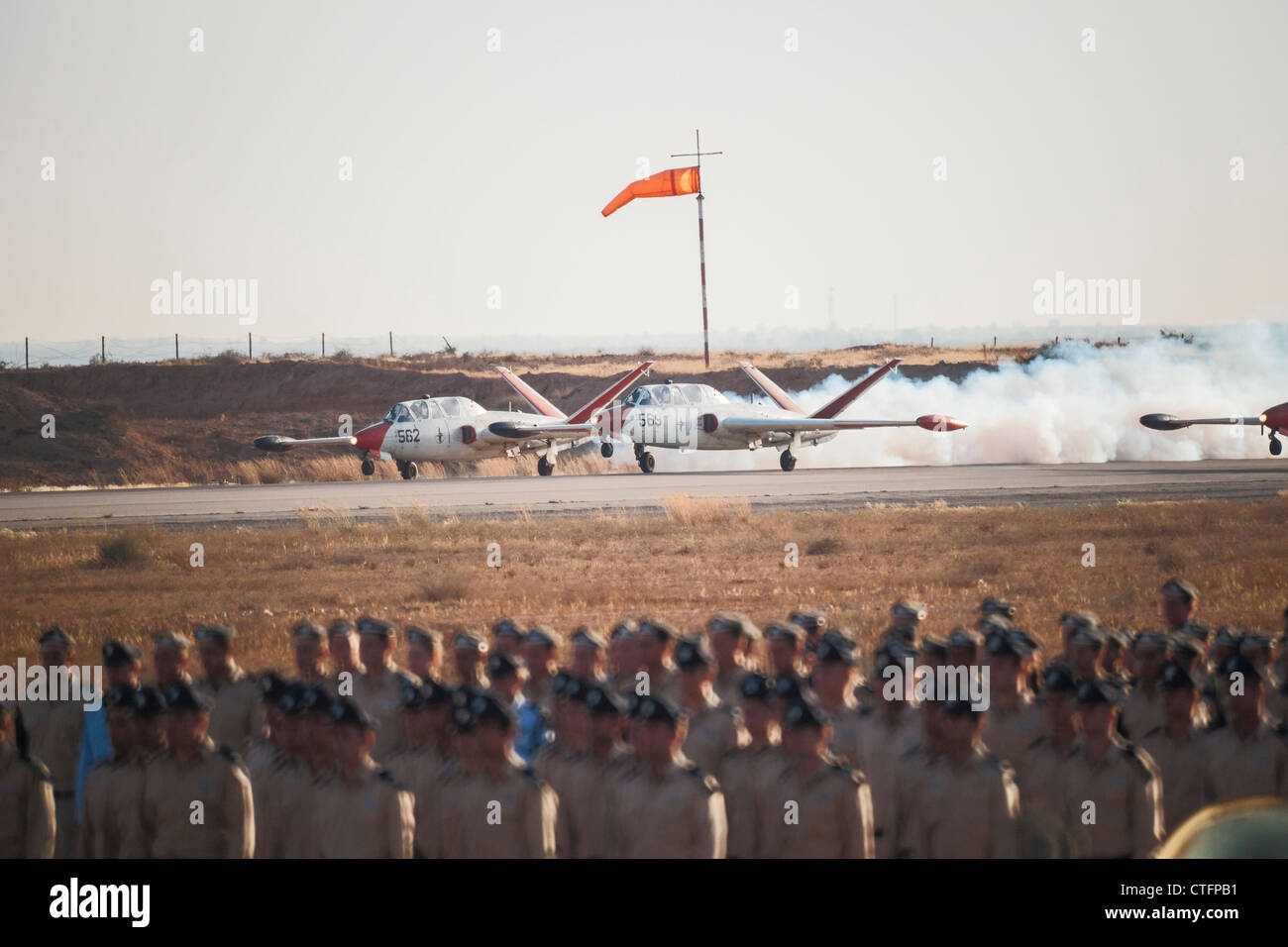 Hazerim AFB, Israel. Israeli Air Force (IAF) Aerobatic team takes off. Flight cadets stand on parade in the foreground. Stock Photo