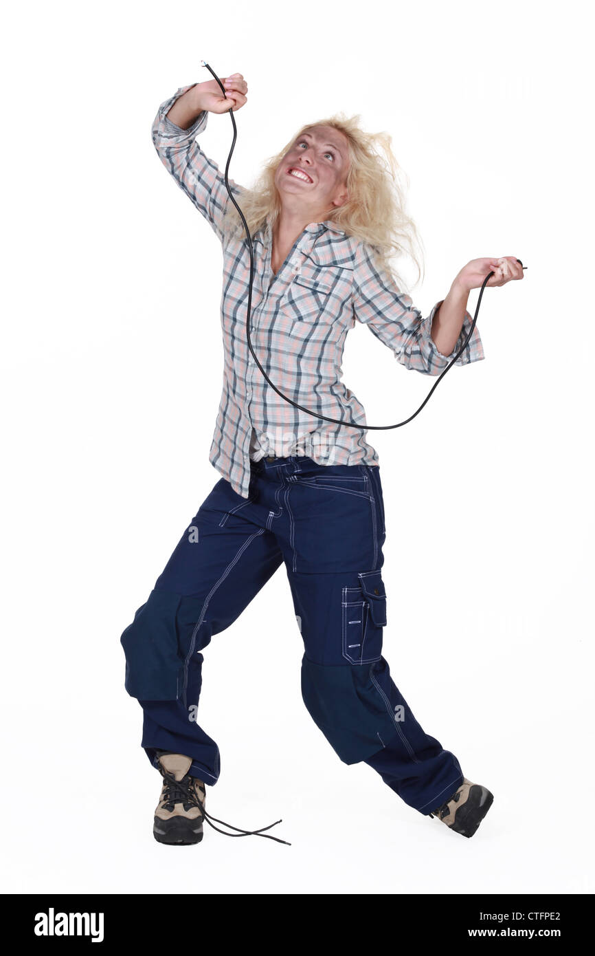 Woman being electrocuted Stock Photo