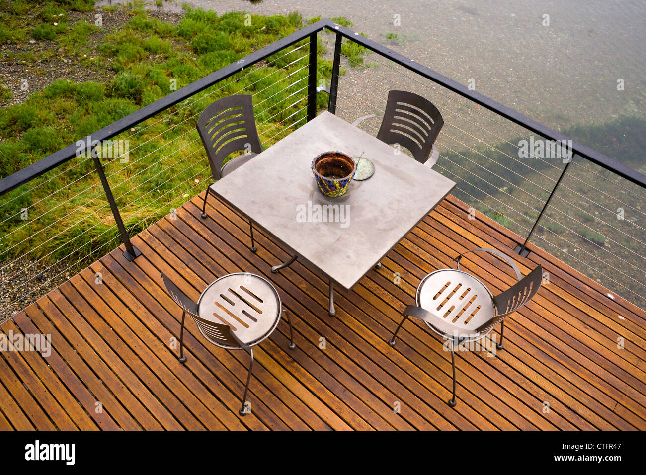 A deck spans out over the water Stock Photo