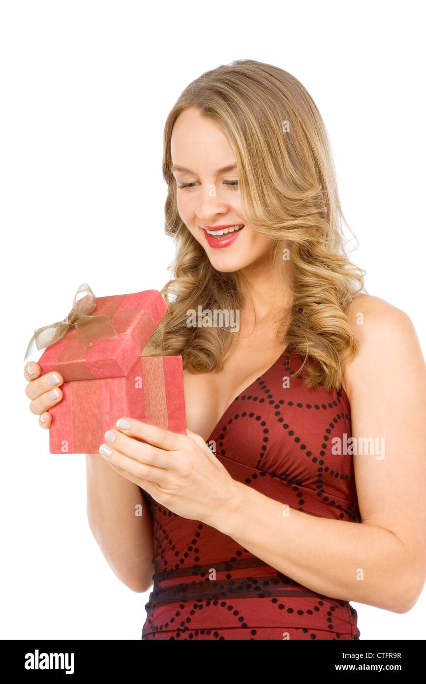 Attractive female excited by surprise Christmas present Stock Photo