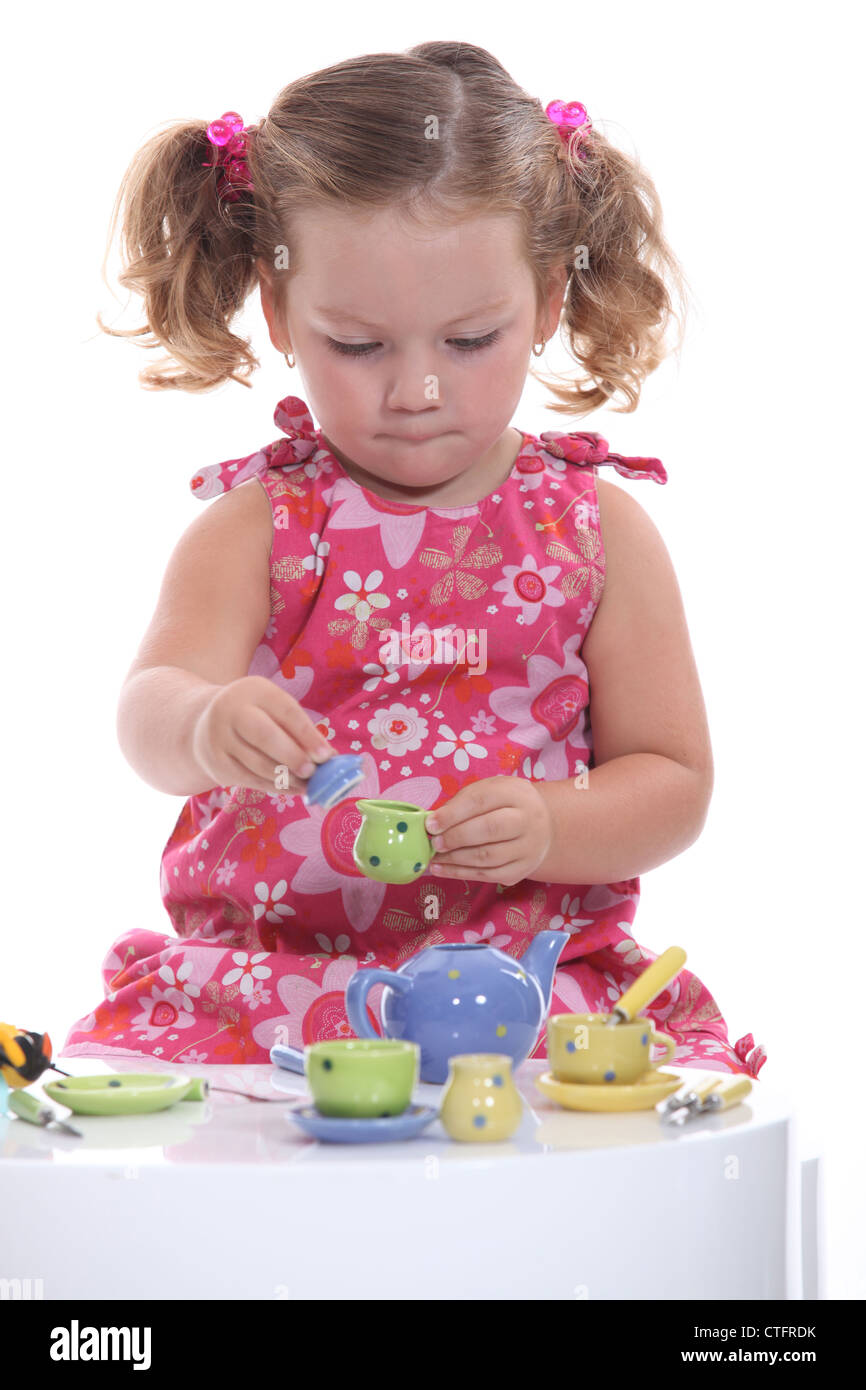little girl playing at tea party Stock Photo - Alamy