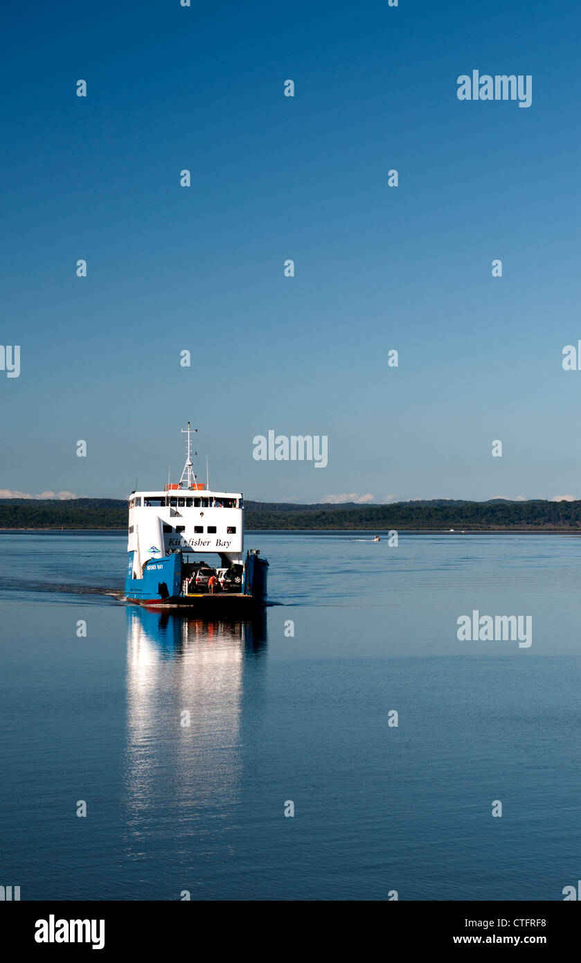 Vehicle ferry brings tourists and cars from Fraser Island to the mainland. Stock Photo