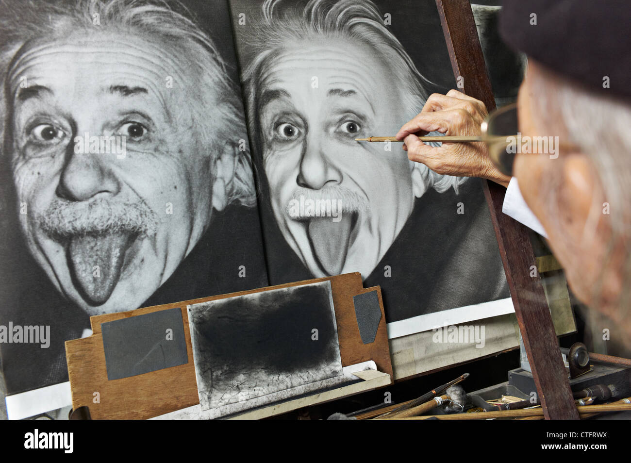 A painter copying a picture of Albert Einstein Stock Photo