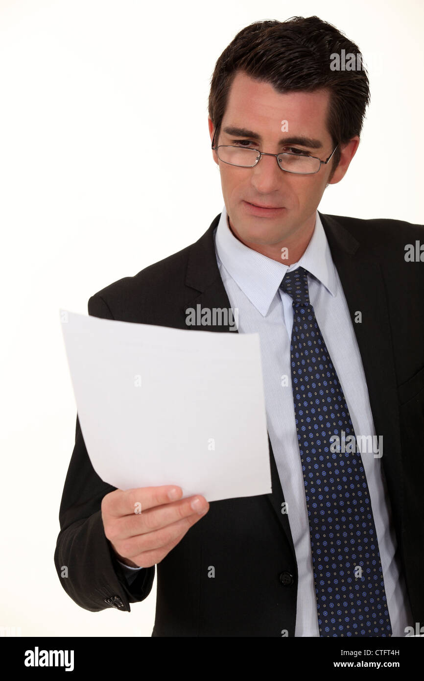 Businessman Reading A Document Stock Photo Alamy