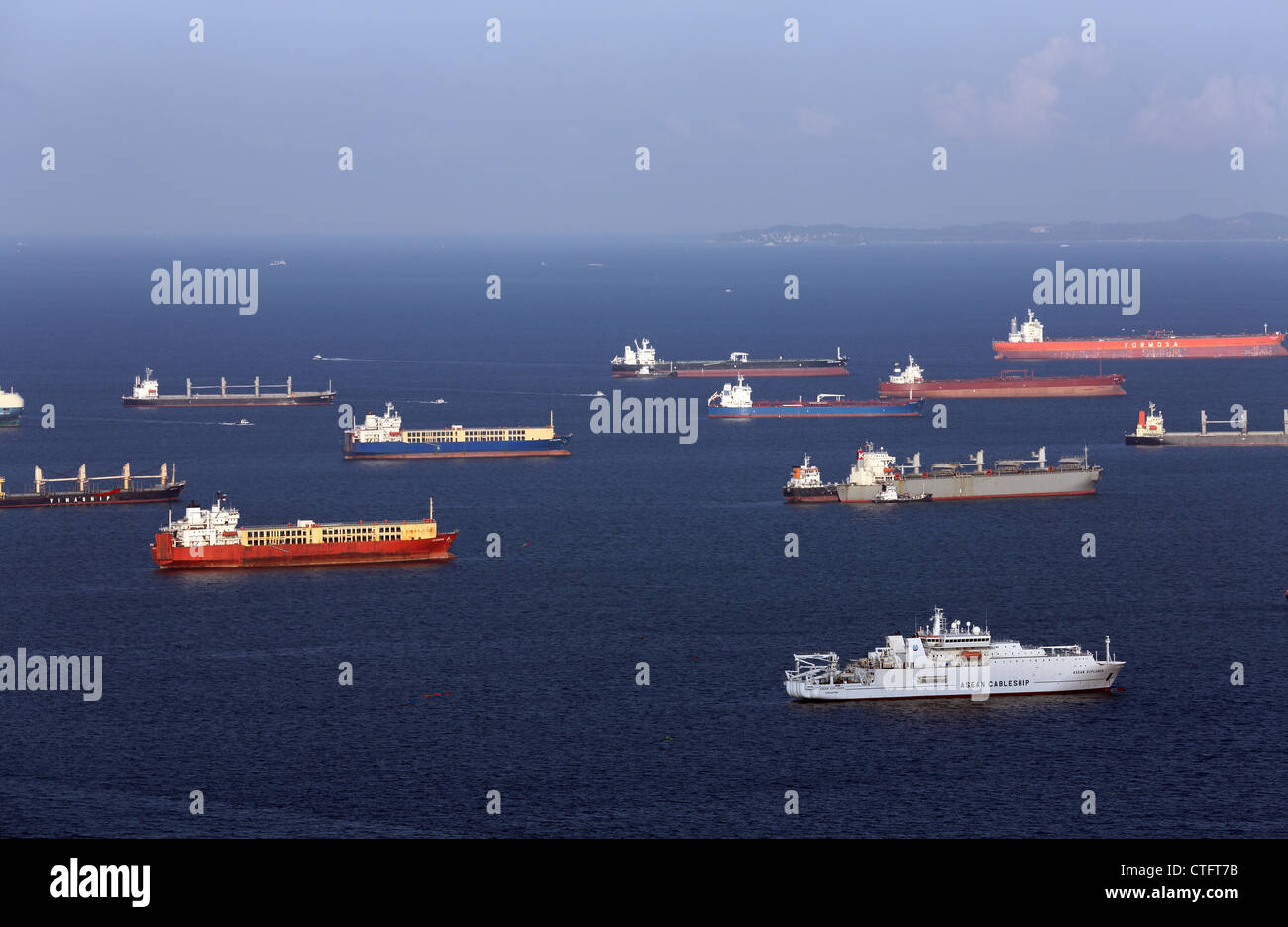 Ships anchored in Singapore Strait waiting for loading and unloading of cargo. Stock Photo