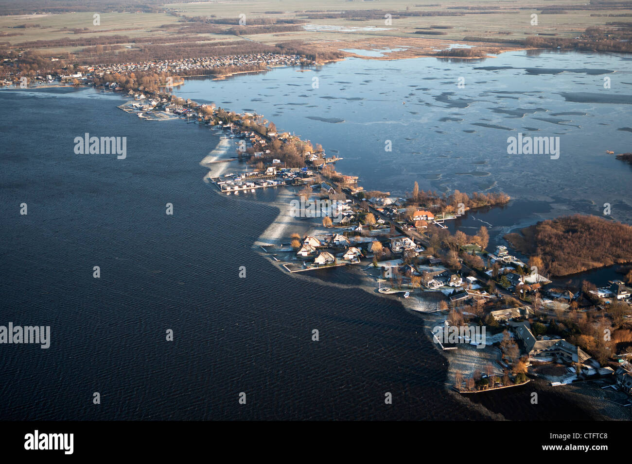 The Netherlands, Loosdrecht, Aerial. Houses near lake called Loosdrechtse Plassen. Winter. Frost. Stock Photo