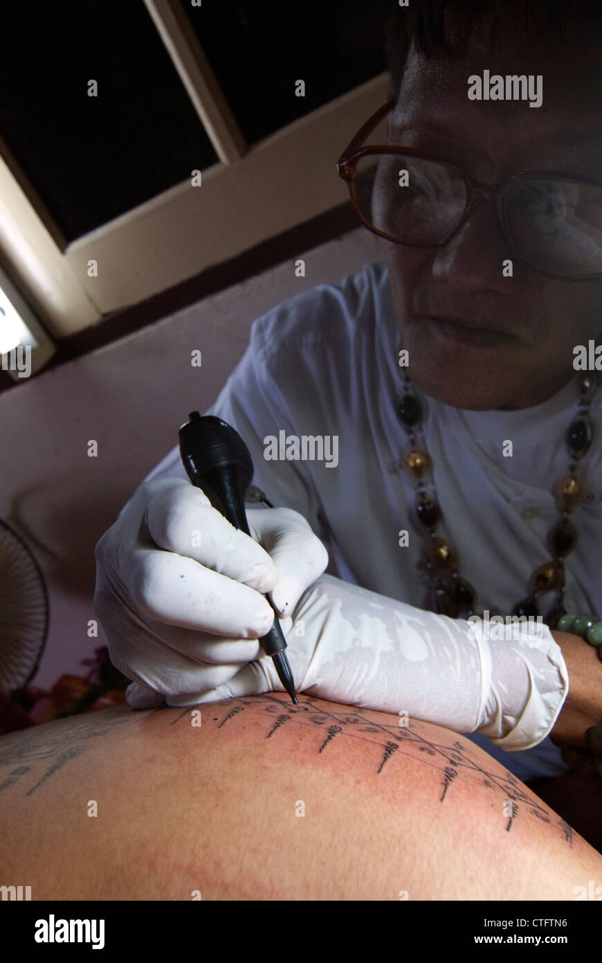 Sak Yan master, Ajahn  Somtawn, Bangkok, Thailand. Sak Yan are the mystical tattoos popular in Thailand. Stock Photo