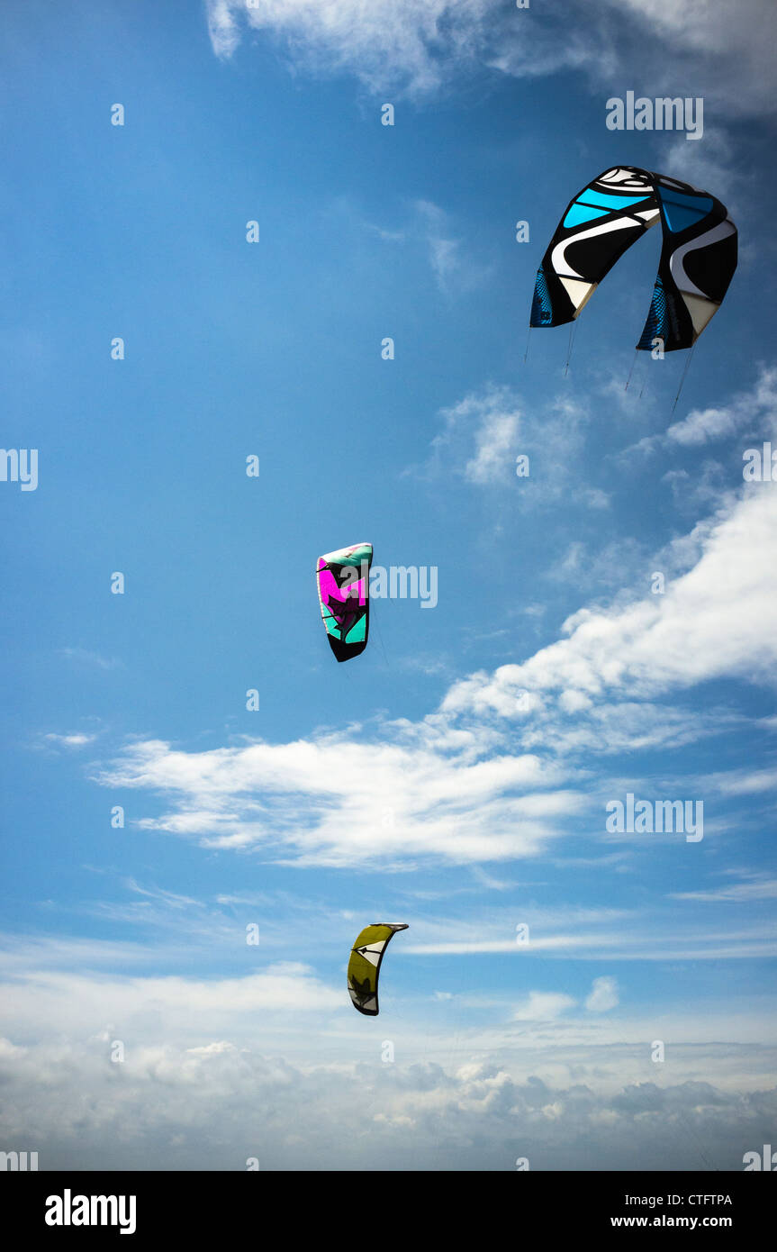 Colourful large (kitesurfing) kites in a blue sky with fluffy clouds Stock Photo Alamy
