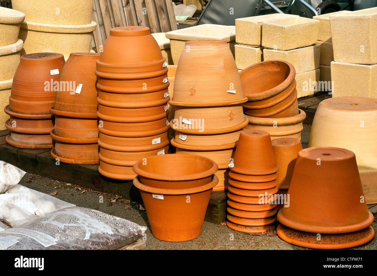 Stacks of fired clay plant pots at garden center France Stock Photo
