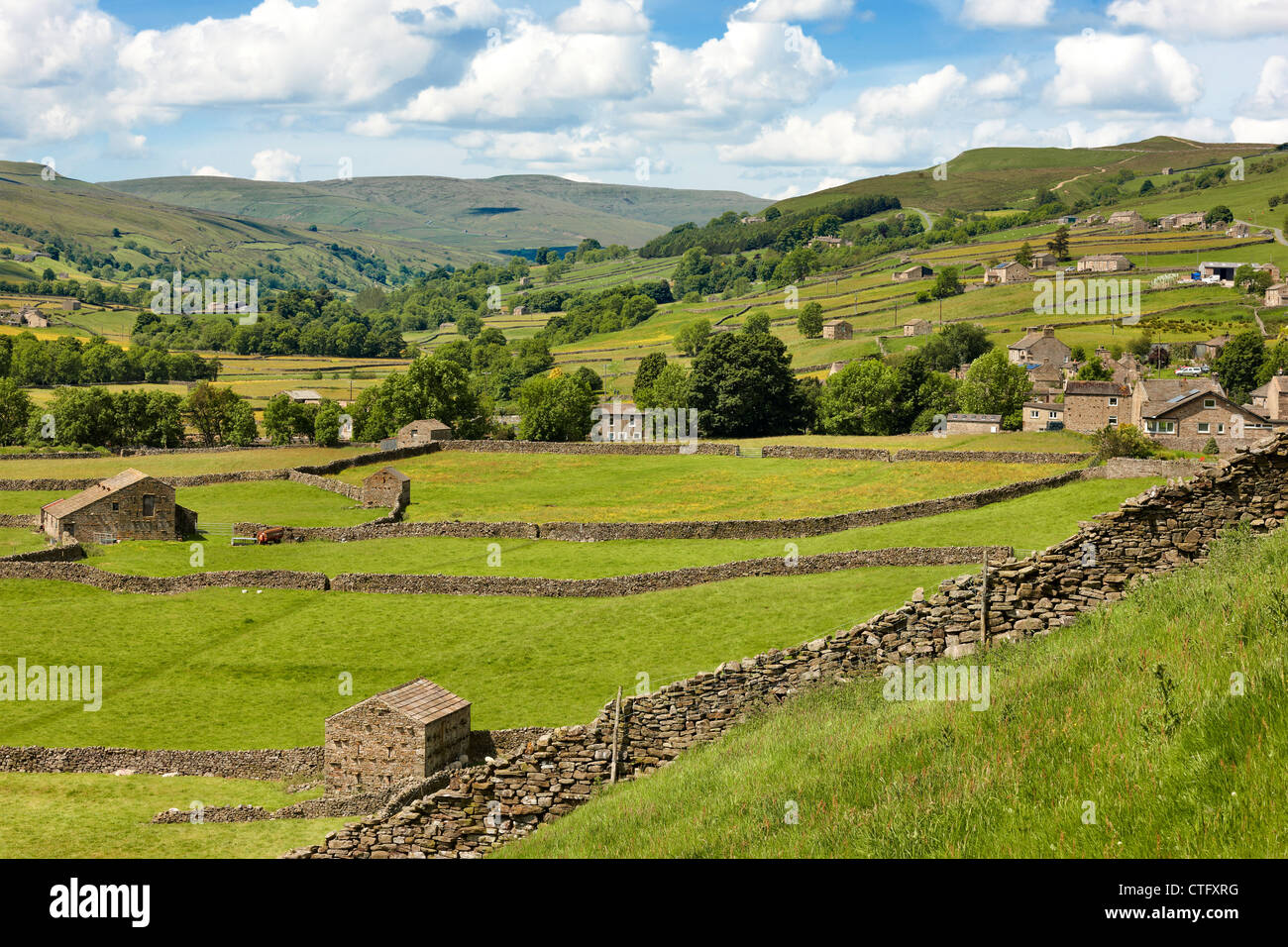 Looking up Swaledale with the village of Gunnerside on the right. Yorkshire Dales UK Stock Photo