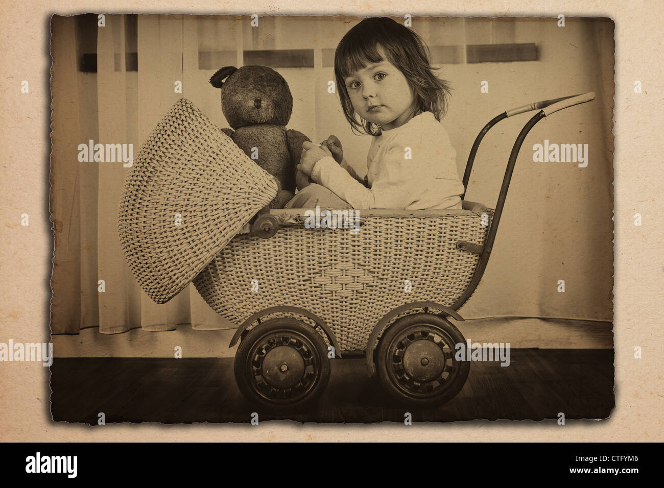 antique,baby,basket,carriage,child,classic,ema,fashion,fashioned,female,girl,kid,old,photo,photograph,sepia,stroller,toddler,tot,vintage,wicker,young,youngster Stock Photo