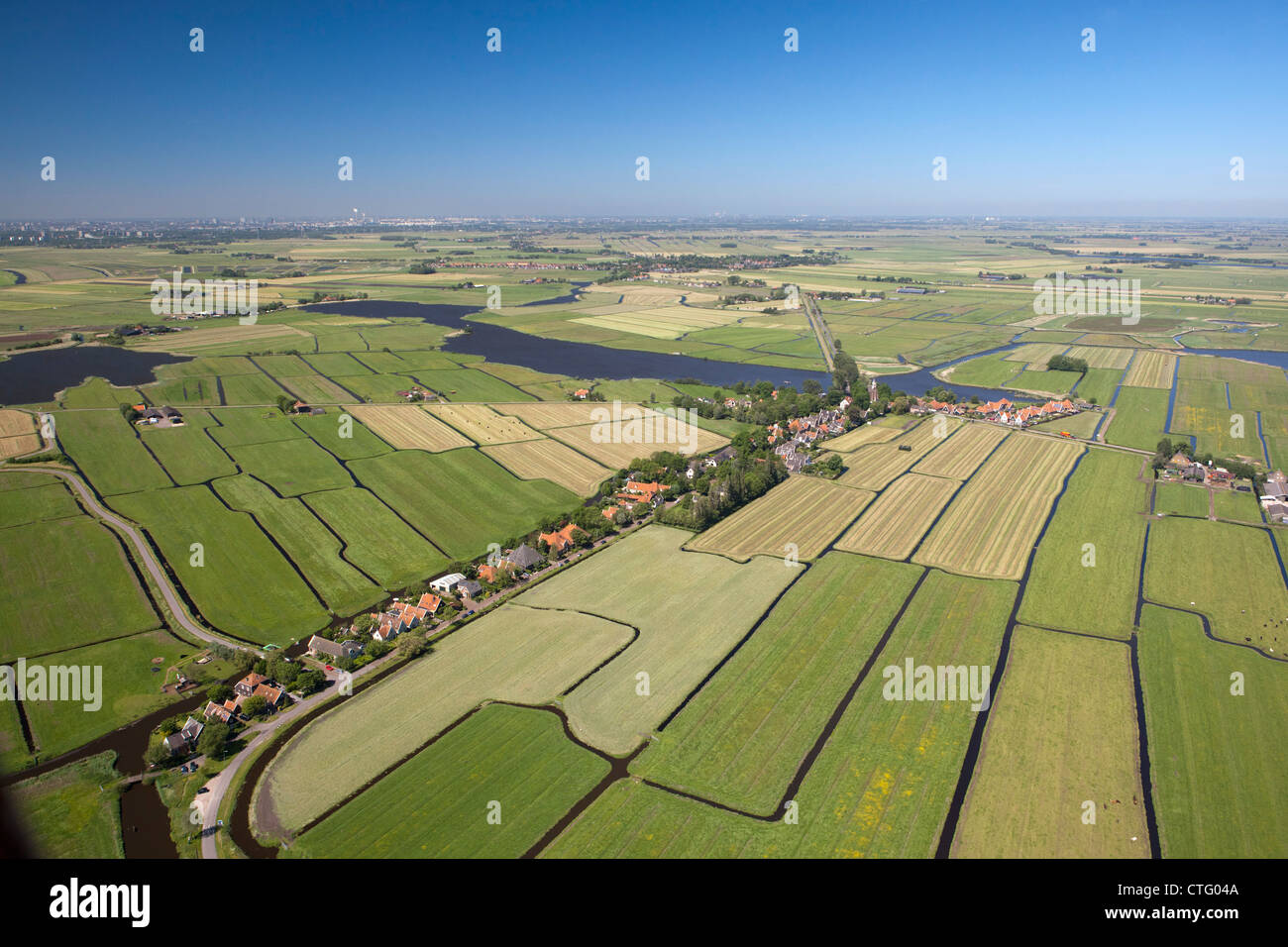 The Netherlands, Zuiderwoude. Aerial. View of village and polder landscape. Stock Photo
