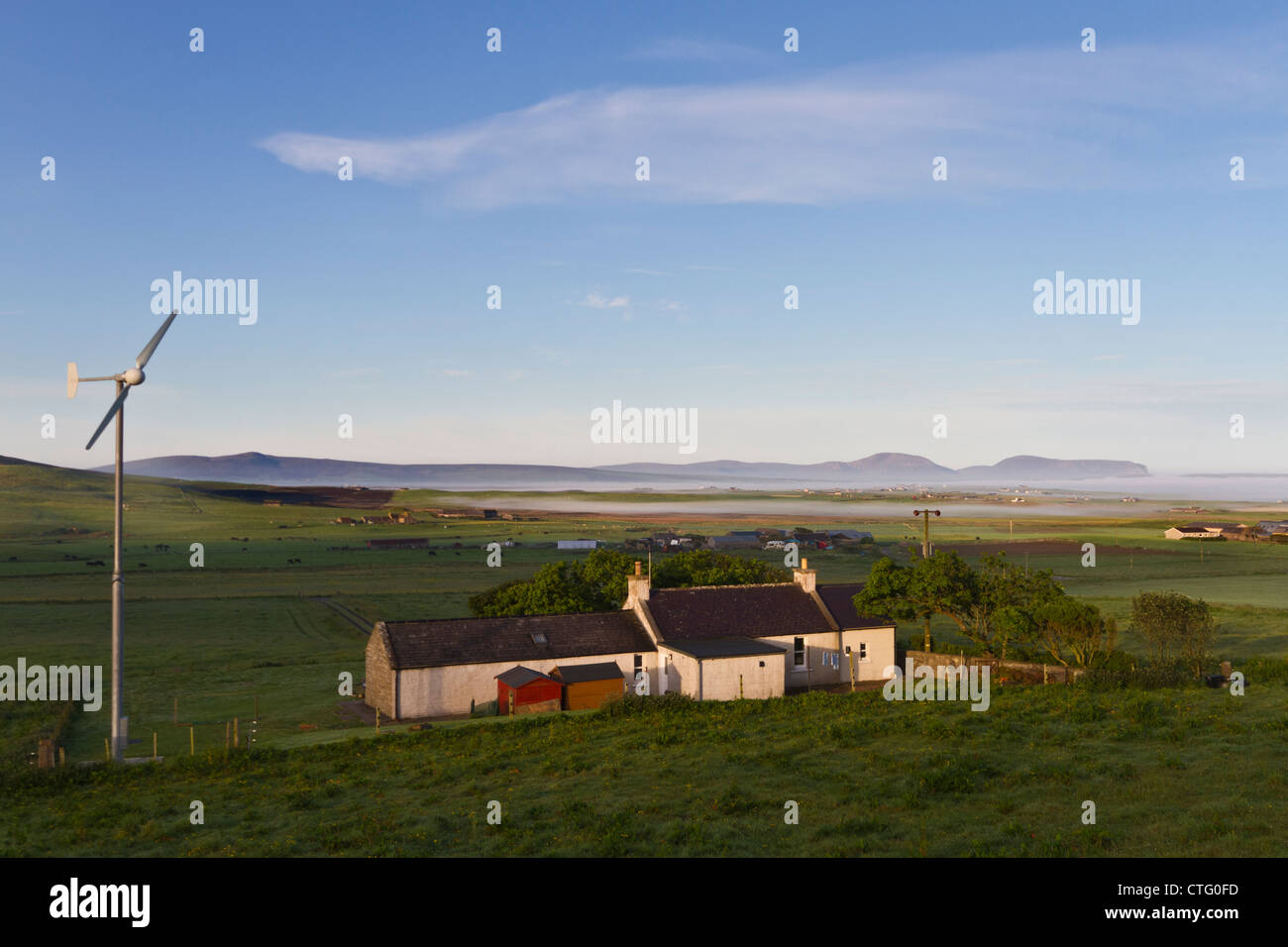 Orkney Islands, cottage with wind turbine Stock Photo