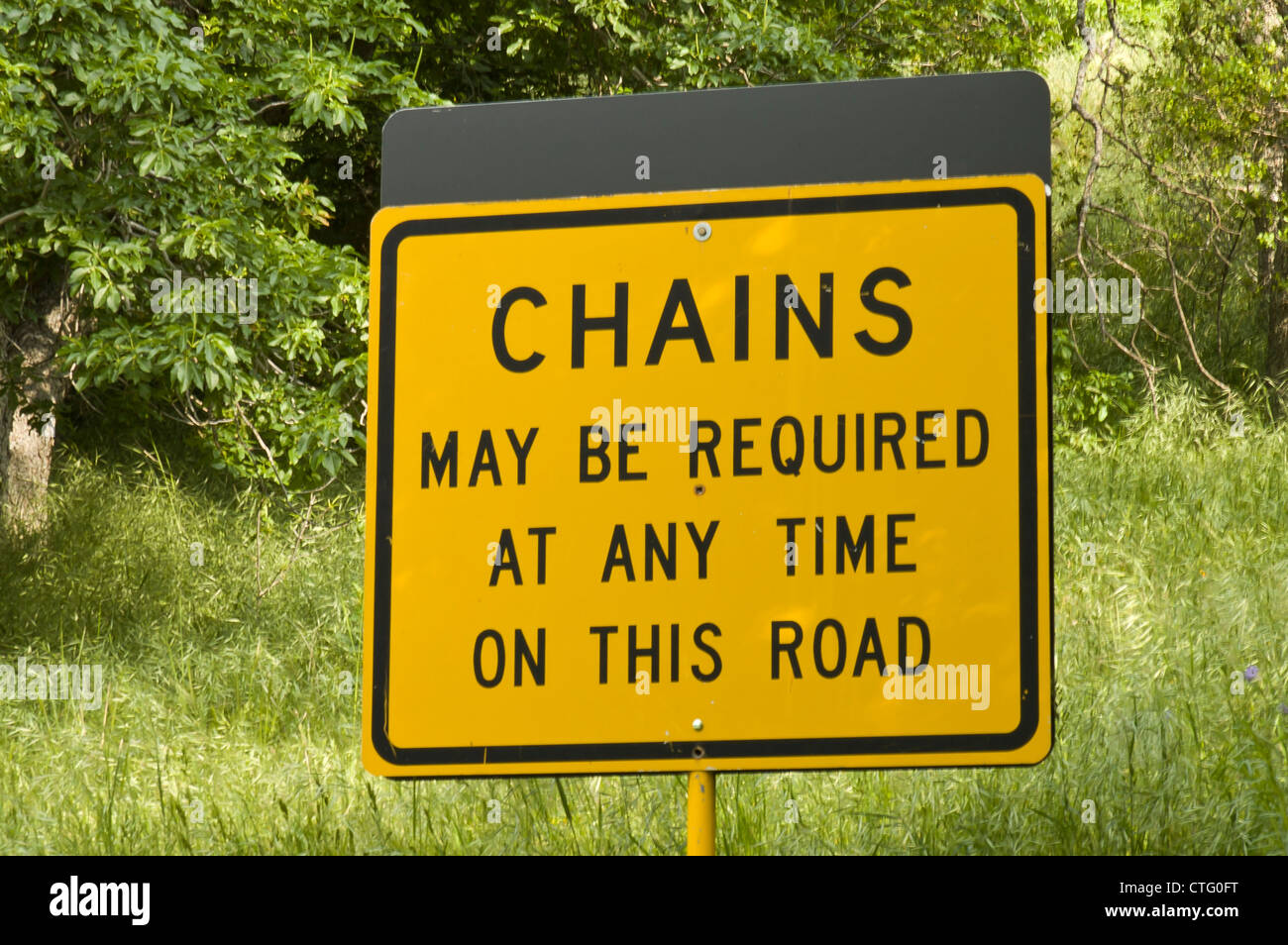 road sign to indicate required chains on a country road of California, USA Stock Photo