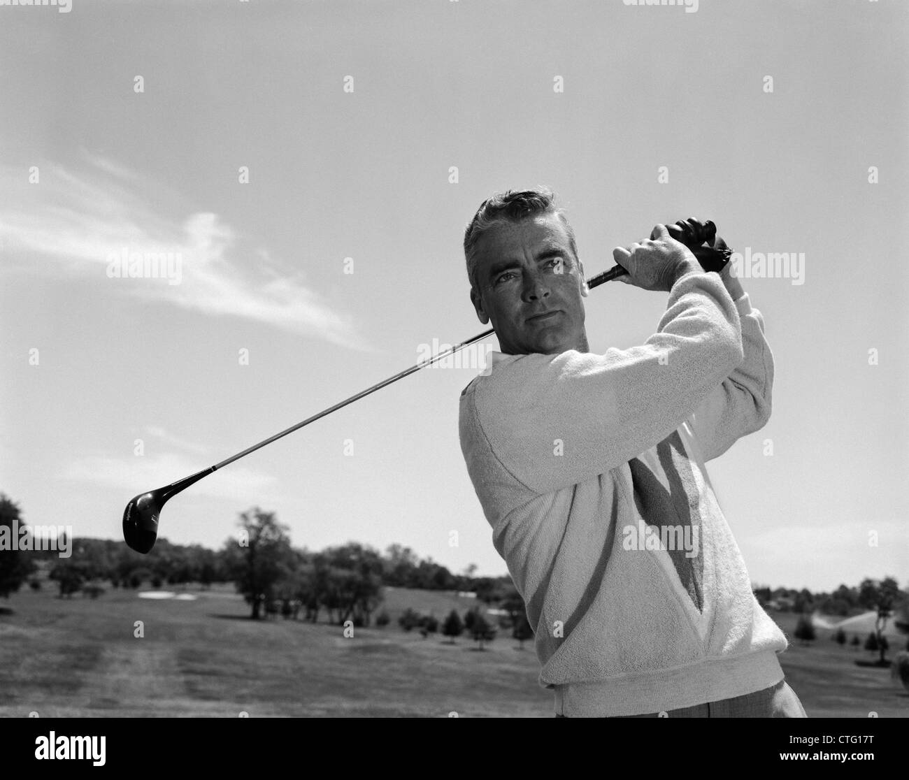 1960s MAN PLAYING GOLF TEEING-OFF GOLF BALL FROM TEE WITH DRIVER OUTDOOR  Stock Photo - Alamy