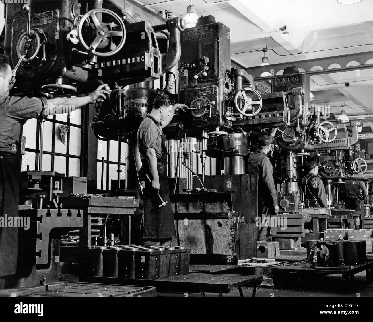1940s 1950s MEN WORKING ON MILLING MACHINES INDOOR Stock Photo
