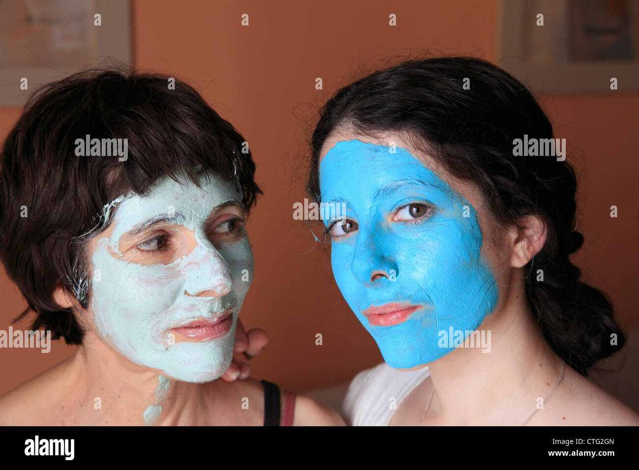 Mother and daughter with facial mask Stock Photo