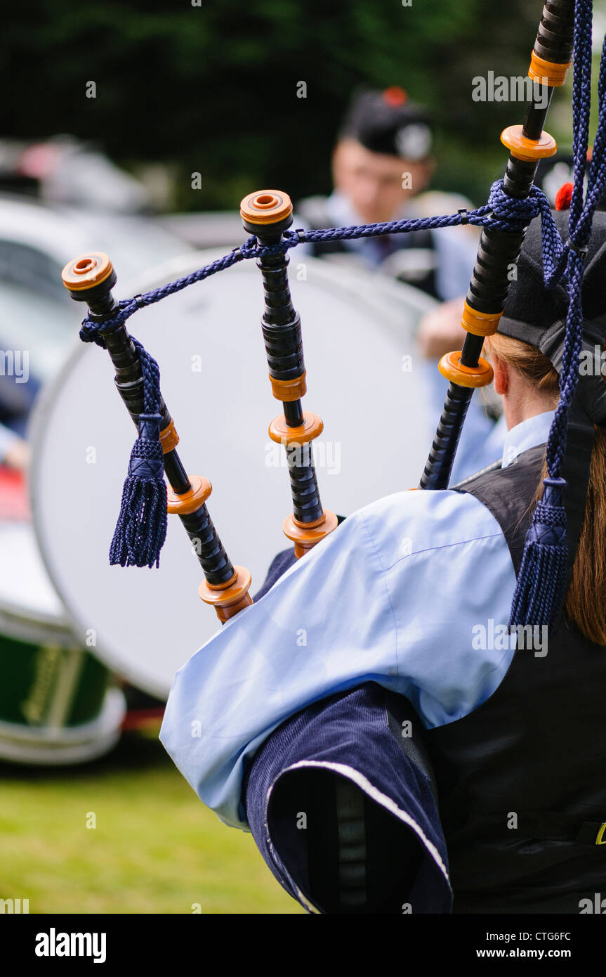 Drones of a set of bagpipes over a piper's shoulder Stock Photo Alamy