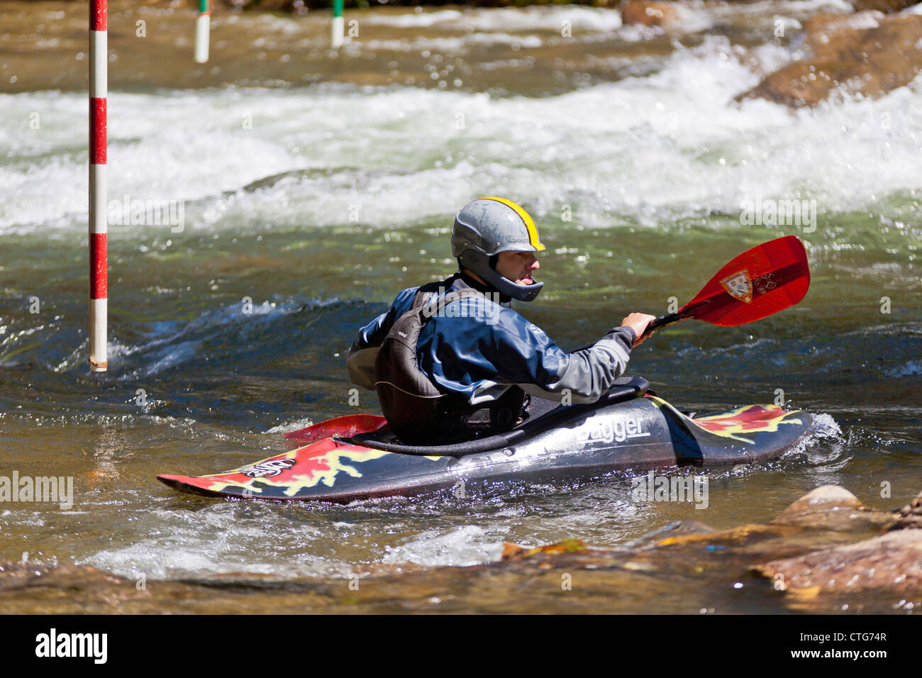 Whitewater kayaker maneuvering kayak in rapids at the Nantahala Outdoor Center in North Carolina Stock Photo