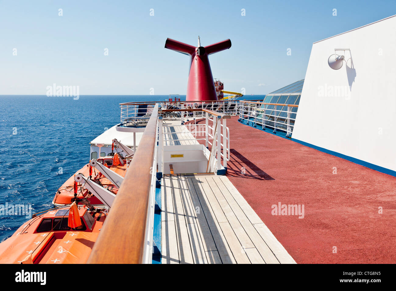 Life boats and running track near stern on the Carnival Fascination cruise ship Stock Photo