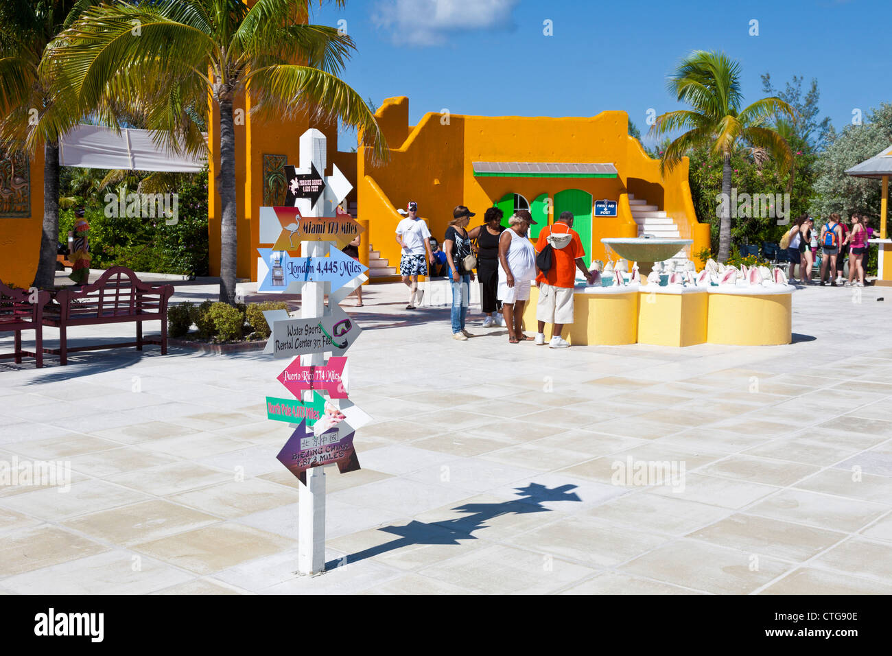 Signs in shopping plaza at Half Moon Cay, Bahamas gives distance to