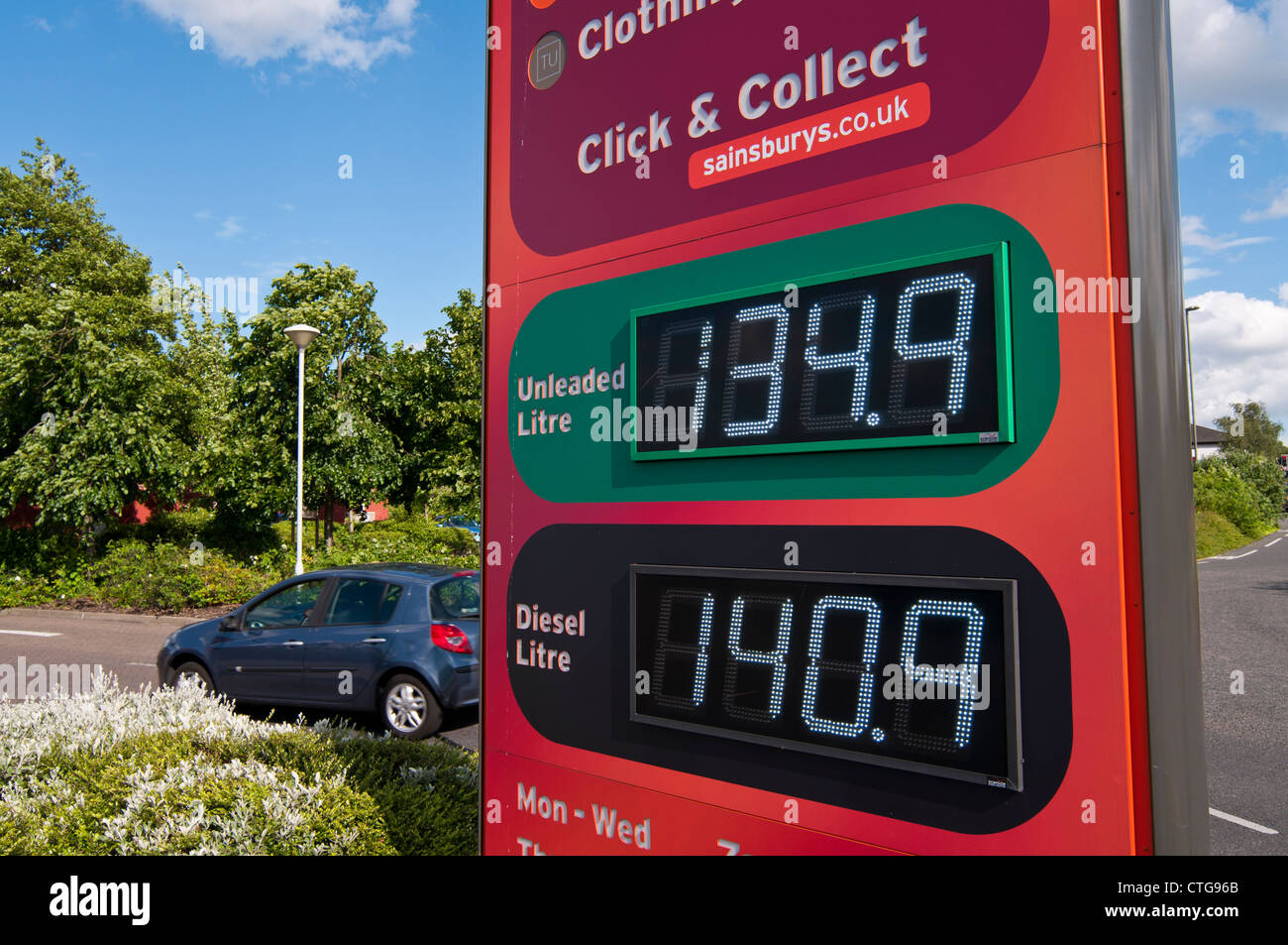 Fuel price display at Sainsbury's petrol station, Surrey, UK Stock
