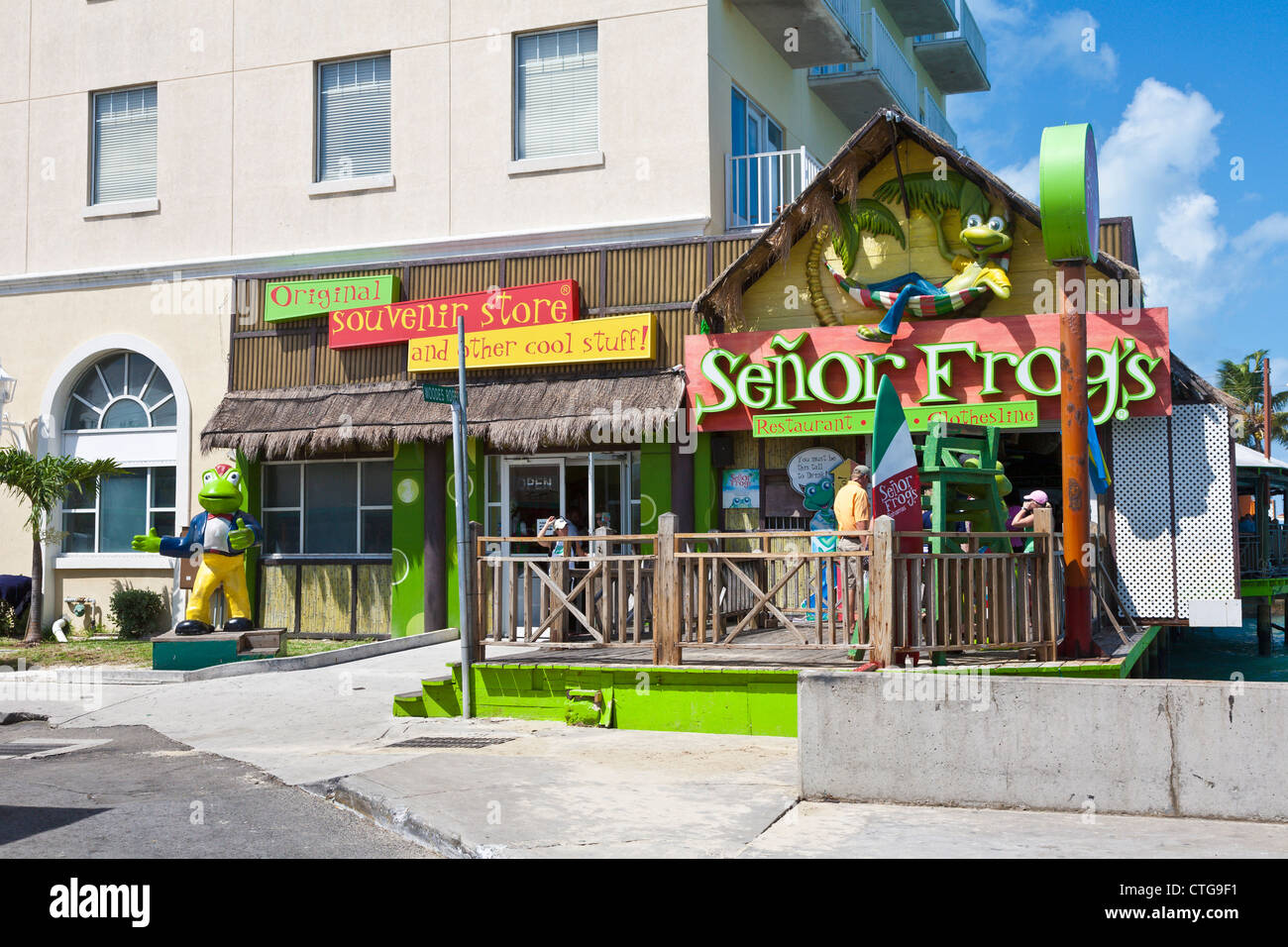 Tourists going to Senor Frog's souvenir shop in Nassau, Bahamas Stock Photo