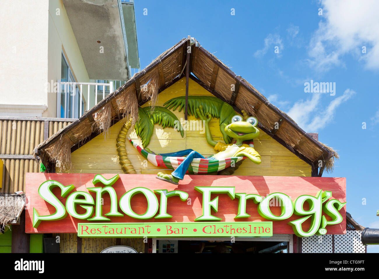 Sign over popular Senor Frog's restaurant, bar and souvenir shop in Nassau, Bahamas Stock Photo