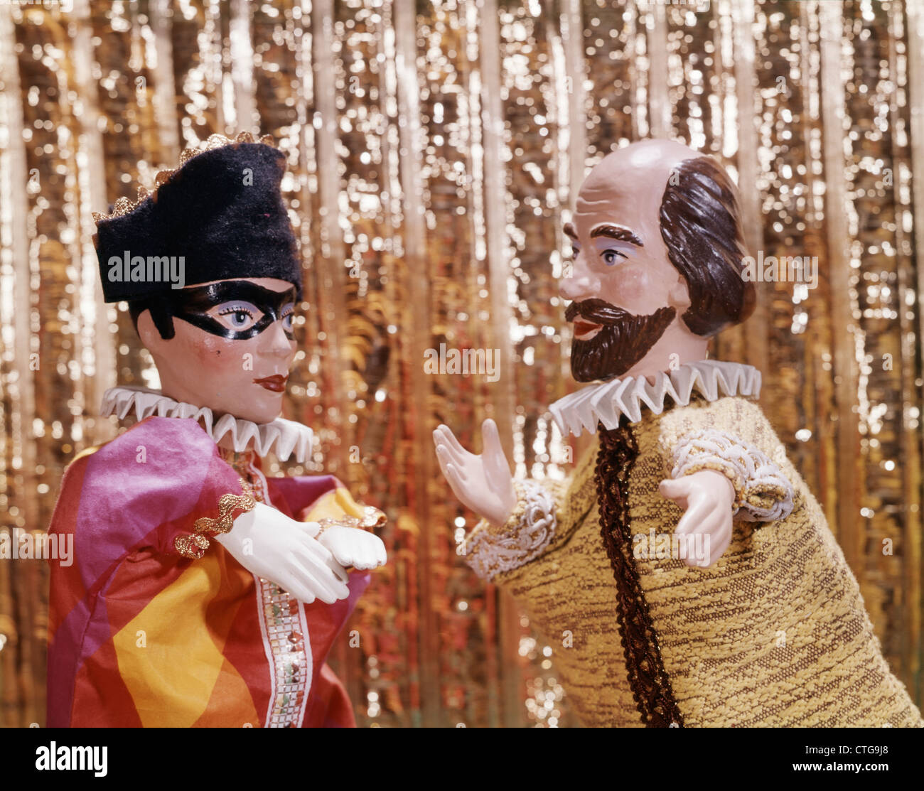 1960s 1970s HAND PUPPETS PUPPET SHOW HARLEQUIN WEARING MASK AND SHAKESPEARE LIKE FIGURE Stock Photo