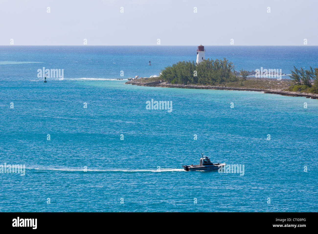 Police boat patrolling waters near Nassau Harbor Lighthouse on Paradise