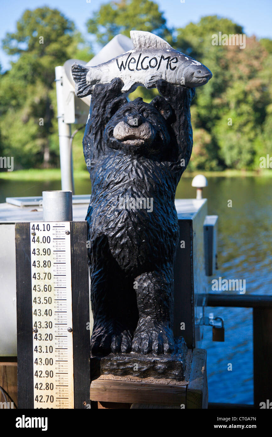Statue bear holding fish on hires stock photography and images Alamy