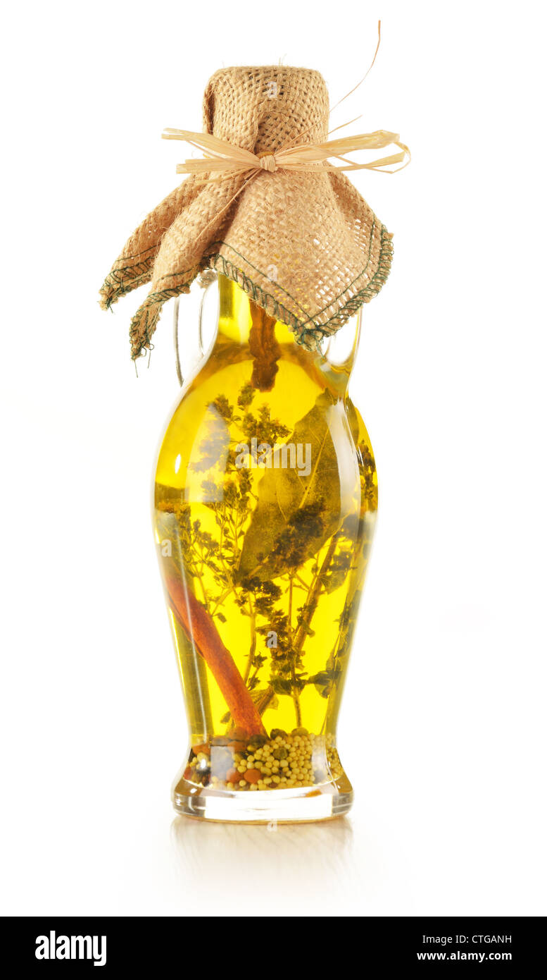 Bottle of extra virgin olive oil with aromatic herbs isolated on white ...
