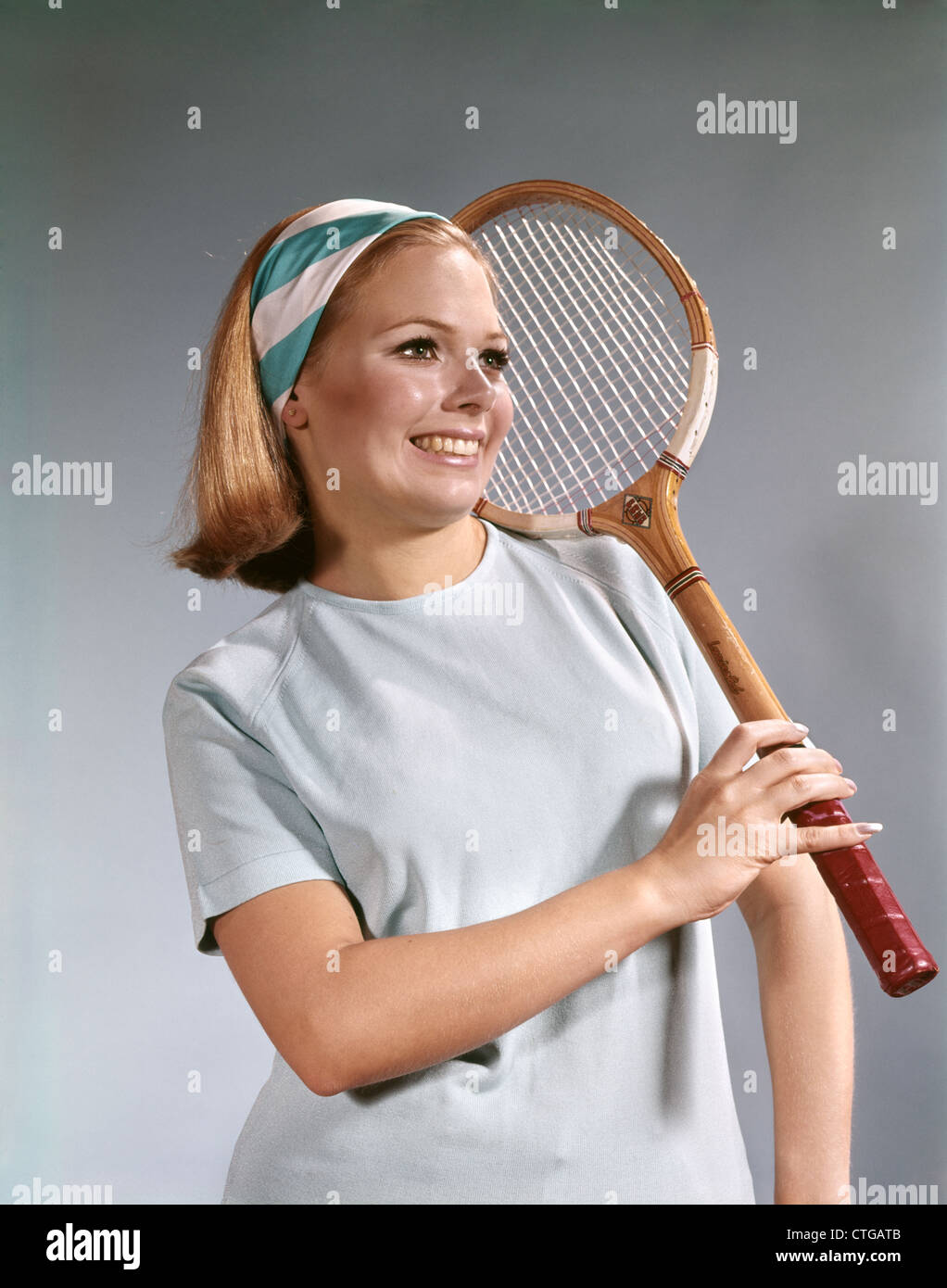 1960s Portrait Young Blonde Woman Holding Tennis Racket Smiling Wearing