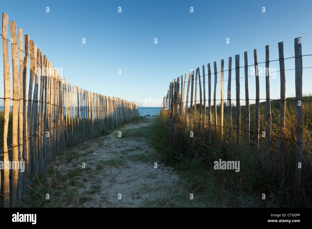 Fenced path through dunes at Kervillen Beach near Carnac. Brittany. France. Stock Photo