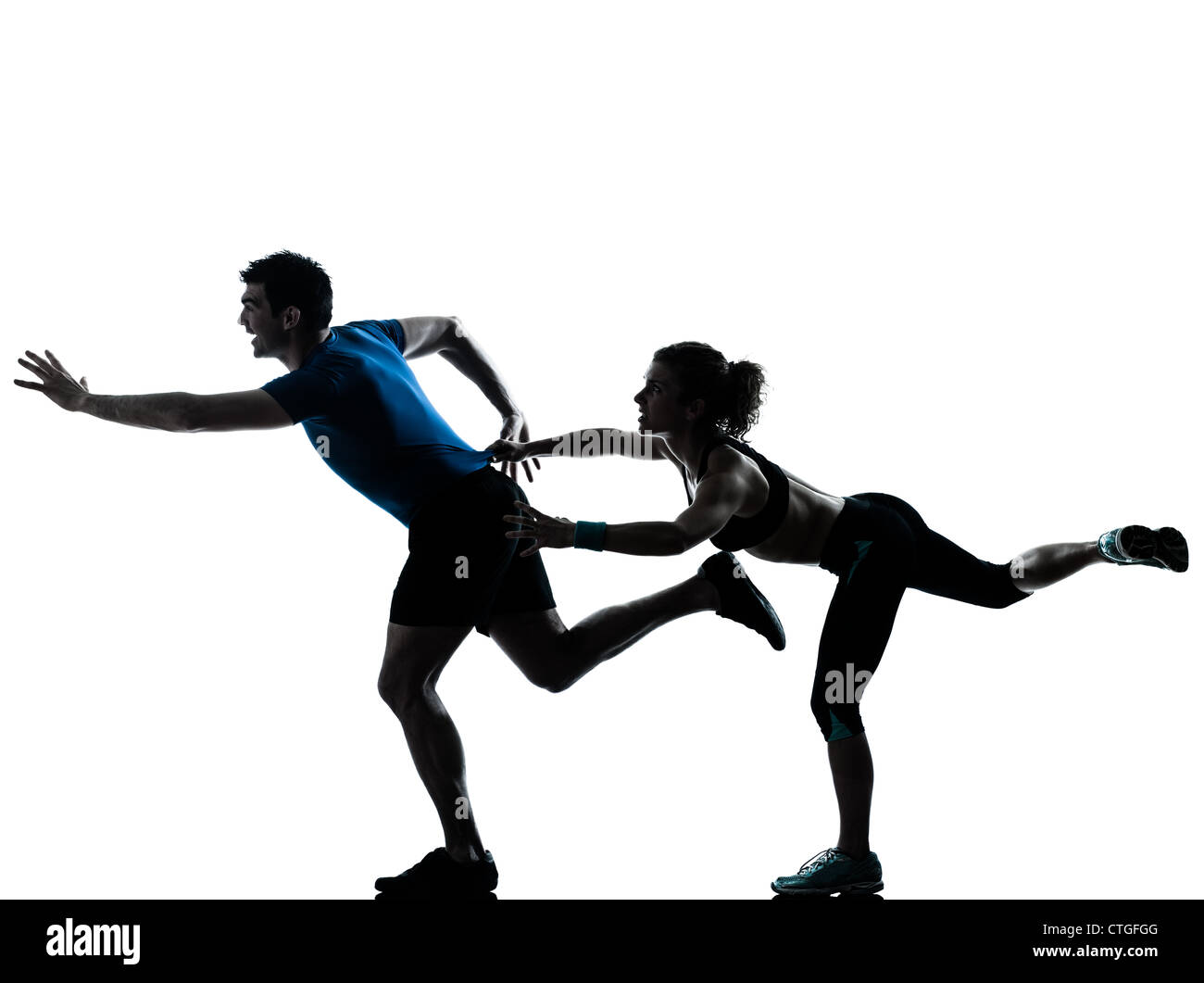 one caucasian couple man woman personal trainer coach runner running jogging sprinting silhouette studio isolated on white background Stock Photo